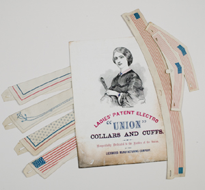 Paper collars and cuffs, with advertising placard for the Lockwood Manufacturing Company, Philadelphia, c. 1863. The Lockwood Company also produced envelopes and stationery decorated with patriotic designs. Gift of John A. McAllister.