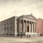 Two classical-style buildings stand at right angles to each other at street corner. Pedestrians and horse-drawn streetcar pass by