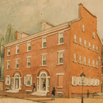 Three-storied brick building with dormer windows and two front doors depicted within circular frame. Male and female pedestrians stroll along sidewalk